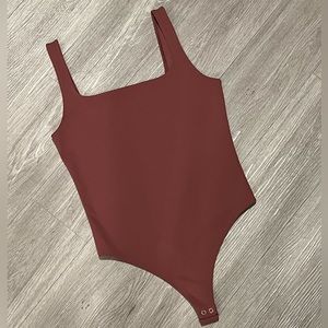 Express body suit in rose, size S NWT